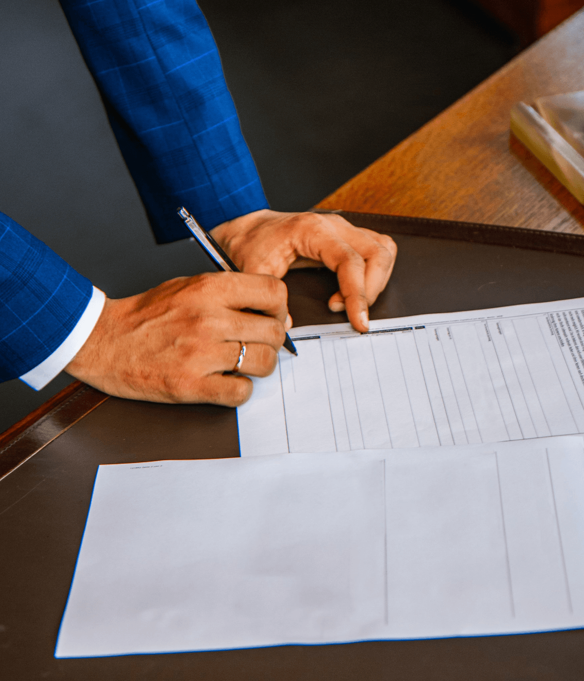 Man filling out document
